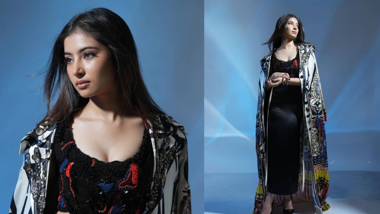 Statement Tribal Jacket with Contemporary Edge<br />The look featured a black crop top paired with a sleek, floor-length skirt, elevated by an oversized statement jacket. Adorned with bold tribal and floral motifs, the jacket added a dramatic, almost rebellious flair, making the outfit a perfect blend of high fashion and artistic expression.