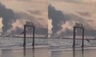 Swinging through chaos: Chilling video captures Iranian girl playing as flames engulf naval base | WATCH