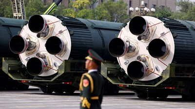 FILE PHOTO: A member of the People's Liberation Army stands as the strategic strike group displays DF-5C nuclear missiles during a military parade to mark the 80th anniversary of the end of World War Two, in Beijing, China, September 3, 2025. REUTERS/Tingshu Wang/File Photo