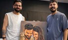 Virat Kohli poses with fan artist after receiving portrait of him and Anushka Sharma
