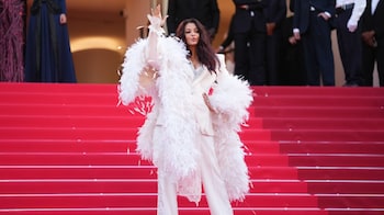 Aishwarya Rai Bachchan closes Cannes 2026 in A dreamy all-white tuxedo look with feathered drama