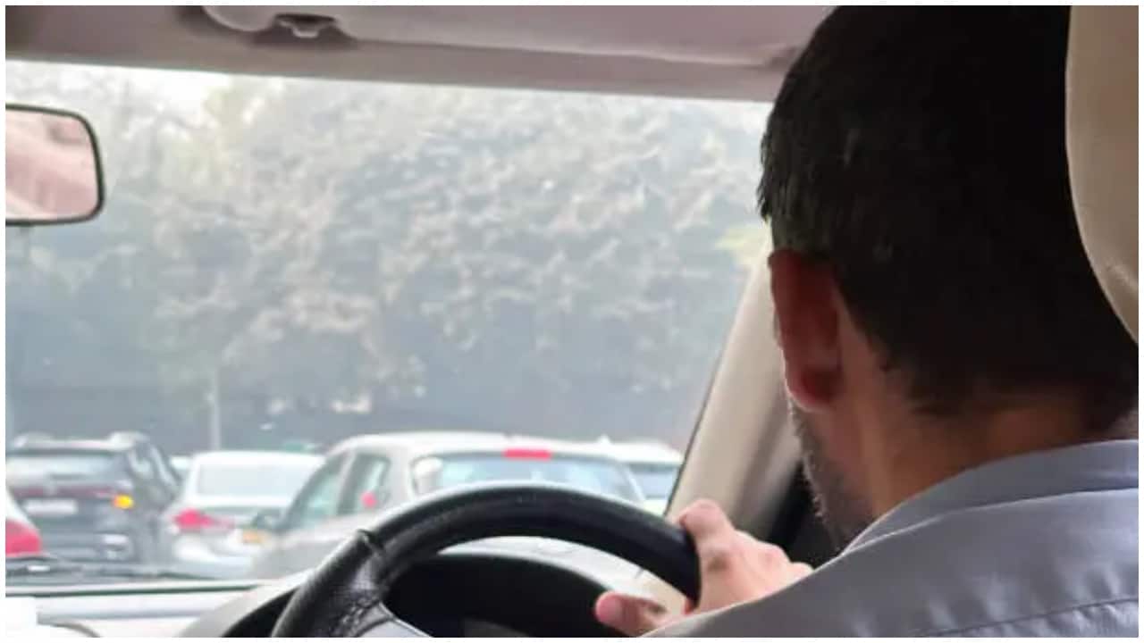 Photo of autonomous vehicle, person at computer, electric car