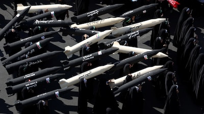Female members of Iranian militia forces (Basij) carry missile mock-ups during a military march in Tehran, Iran, September 18, 2026. Majid Asgaripour/WANA (West Asia News Agency) via REUTERS