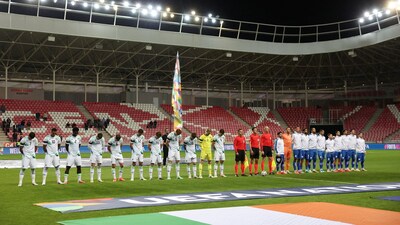 Republic of Ireland players bow their heads and wear black armbands in recognition of all lives lost in the Gaza conflict during the national anthems before the match. Reuters