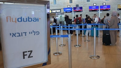 Passengers queue at the flydubai counters in Ben Gurion Airport near Tel Aviv on September 30, 2026. (Photo by Jack GUEZ / AFP)