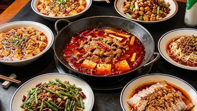 AI-powered robots prepare Sichuan dishes while diners judge their familiar flavours. (AI-generated representative image)