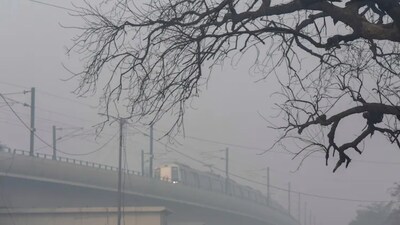 A Delhi Metro train runs amid low visibility due to a layer of smog, in New Delhi. (Photo: PTI)