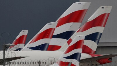 FILE PHOTO: Livery of British Airways passenger planes are seen at Heathrow Airport in west London, Britain, January 28, 2025.  REUTERS/Toby Melville/File Photo