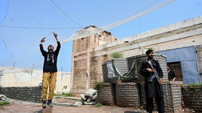 Security personnel fortifying a police post with Ukraine-style mesh barriers, as a new line of defence against drone and aerial attacks at Bara in Pakistan's Khyber Pakhtunkhwa province on August 4, 2026. (Photo by Abdul MAJEED / AFP)
