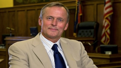 John Grisham's answer to a simple AI question has the internet choosing sides