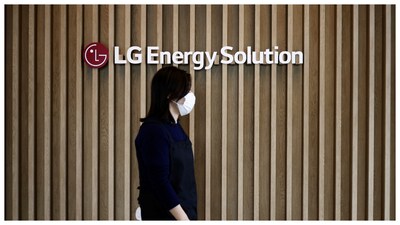 An employee walks past the logo of LG Energy Solution at its office building in Seoul. (Courtesy: Reuters file photo)