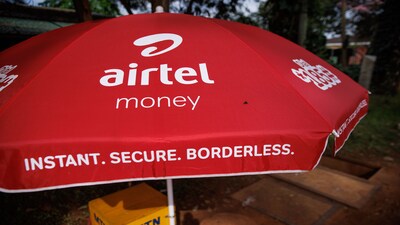 A branded sun parasol at an Airtel mobile money kiosk in Kampala, Uganda. Photographer: Luke Dray/Bloomberg