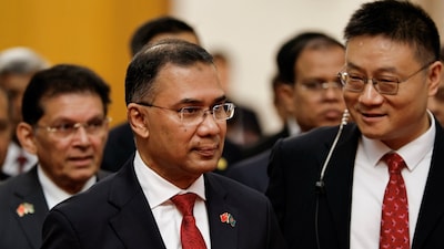 (FILES) Bangladesh's Prime Minister Tarique Rahman arrives for a meeting with Chinese President Xi Jinping at the Great Hall of the People in Beijing, China June 26, 2026. REUTERS/Tingshu Wang/Pool