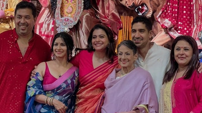 Kajol poses with her family