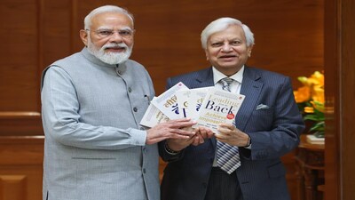 Ravi Kant, former Managing Director and Vice Chairman of Tata Motors, presents his book Leading from the Back to Prime Minister Narendra Modi